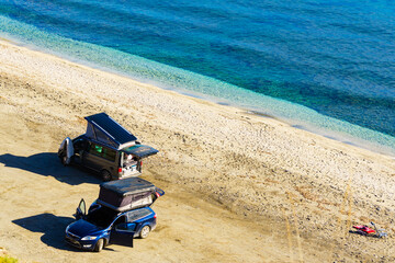 Cars with roof top tent camping on beach