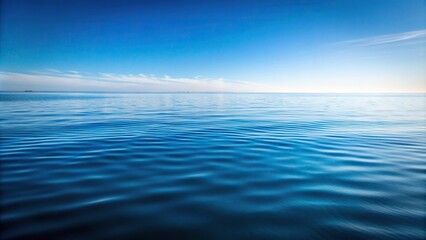 Obraz premium Tranquil water surface reflecting sky and clouds