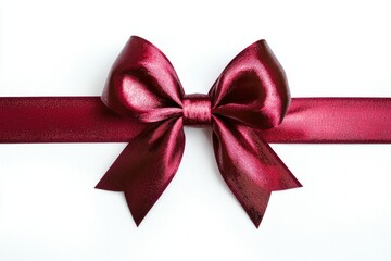 Fototapeta premium A close-up image of a shiny burgundy ribbon bow resting on a white background, often used for gift wrapping.