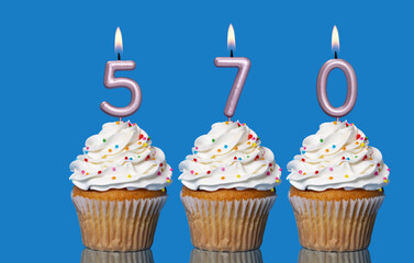 Birthday Cupcakes With Candles Lit Forming The Number 570