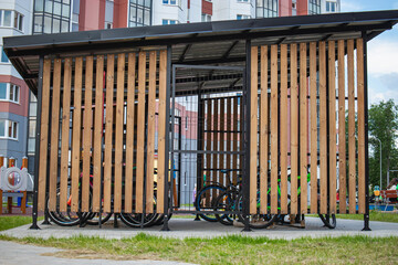Modern indoor bicycle parking area in a residential neighborhood designed for secure bicycle...