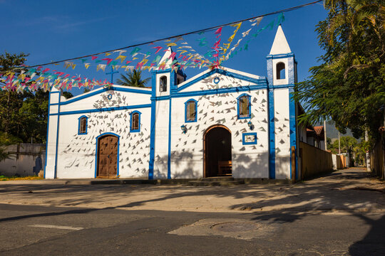 Church Chapel Sao Joao Batista, in Ilhabela, north coast of Sao Paulo, Brazil, decorated with typical party celebration Junina flags.
