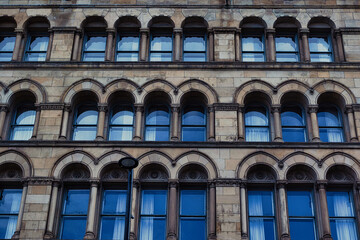 Obraz premium Stone Building Facade with Arched Windows