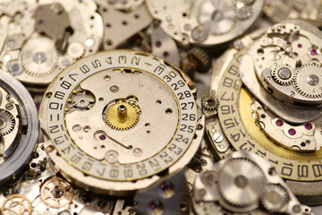 Old mechanical watches with gears and cogs. Watch or clock mechanisms