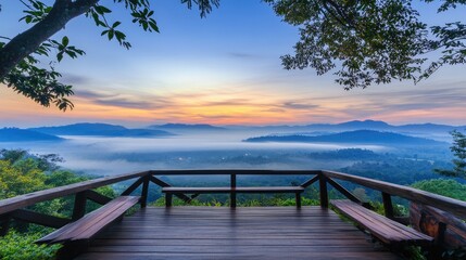 Serene Sunrise Over Misty Mountains and Viewing Deck