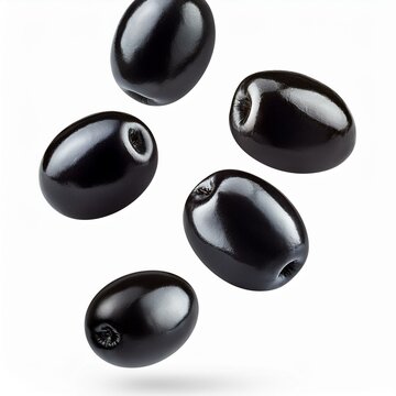levitating black olives isolated on a white background