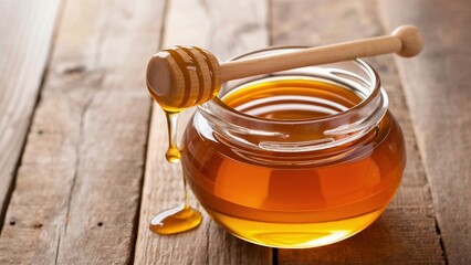 Jar of Honey with Wooden Dipper on Rustic Table