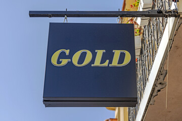 GoHanging Black Box Gold Sign at Jewelery Shop Sunny Day