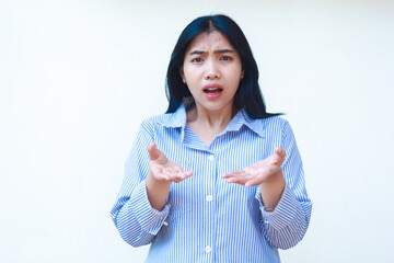 confused asian woman wearing casual stripes shirt pointing finger to empty space thinking choices...