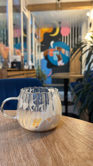 Empty cup with coffee in the shape of a pumpkin