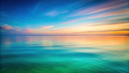 Obraz premium Serene Ocean at Sunset with a Vibrant Sky Reflected in the Calm Waters