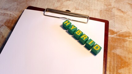 HYBRID technology electric motor business idea Written on wooden cubes for advertising.