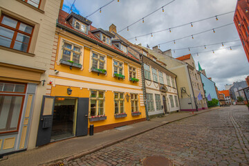 Old street in old Riga. The city is capital of Latvia that is well known to be a very popular...