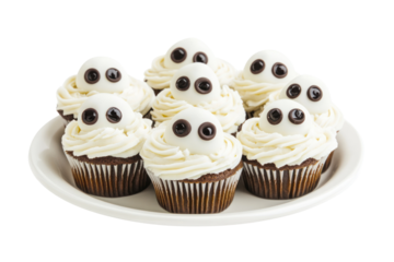 A plate filled with homemade ghost-shaped cupcakes, frosted with white icing and decorated with chocolate chip eyes and mouths. The cupcakes are arranged in a whimsical pattern,