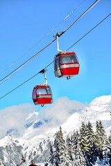 Vintage Ski gondola over the slopes of Courchevel ski resort, French alps © raeva