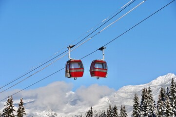 Vintage Ski gondola over the slopes of Courchevel ski resort, French alps