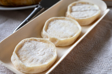 Rocamadour or cabecous soft goat AOC cheese with soft rind produced on farm in Perigord and Quercy on farmers market, departement Lot, France