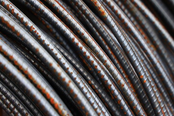 Many rusty rebars rolled together