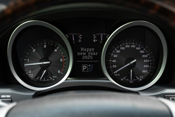 Close up black speedometer with Happy New Year   2025 . The concept of the new year and Christmas...