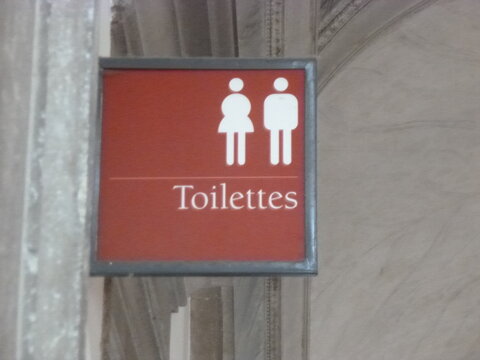 Panneau toilettes rouge