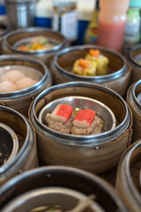 Close up dim sum chinese food in bamboo basket on a dining table, dim sum, Thailand