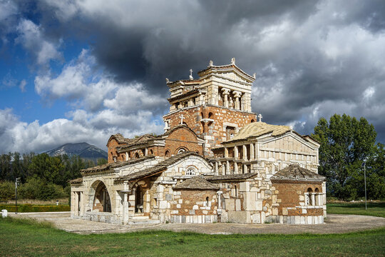 The unique architecture of Church of Agia Foteini, in Mantineia region, Arkadia, Greece, combining traditional byzantine elements with uncoventional design, set against  dramatic sky with dark clouds.