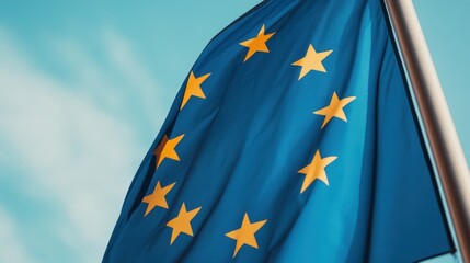 european union flag waving against blue sky