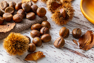 Chestnuts on a wooden table.
Tasty chestnuts image.
