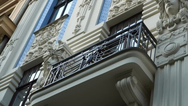 The historical facade of an Art Nouveau building with its sculptural elements stands out in one of the most renowned Jugendstil-style neighborhoods along Alberta Street in Riga, Latvia's capital.
