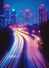 Obraz premium A long exposure shot of a highway with light trails leading through a city at night.