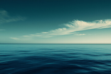 An endless sea, the horizon is visible in front of you. The sky above is clear and blue with a few white clouds floating