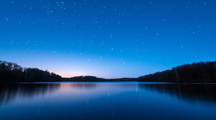 A serene lakeside view with a star-filled sky reflecting on the water, Night landscape, tranquility