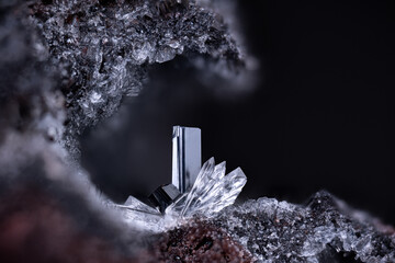Pseudobrookite with colorless Topaz. Specimen from Wannenköpfe, Ochtendung, Germany. Micro...