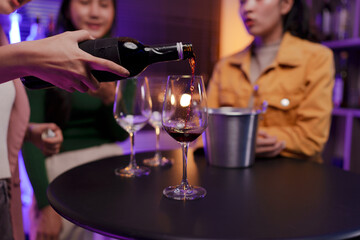 Asian women celebrating, meeting and chatting in a bar. Places to visit, beautiful lights