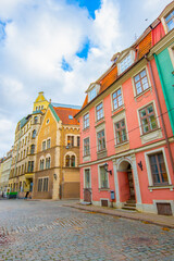Obraz premium Old street in old Riga. The city is capital of Latvia that is well known to be a very popular tourism destination in the Baltic region