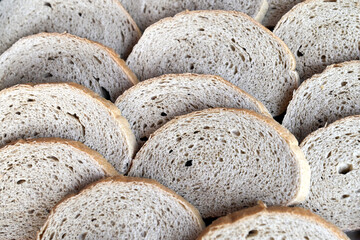 Sliced of fresh bread as a background. Texture.