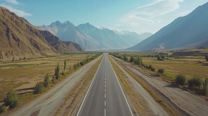 Long road through stunning mountain landscape.