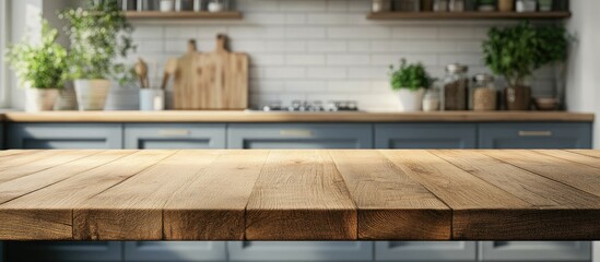 Wood table top set against a blurred kitchen background Suitable for product display montage or key visual layout design. with copy space image. Place for adding text or design