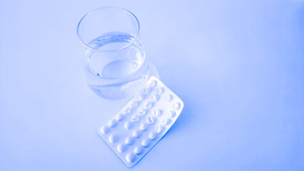 Colorful vitamin pills in a bottle on an isolated background 