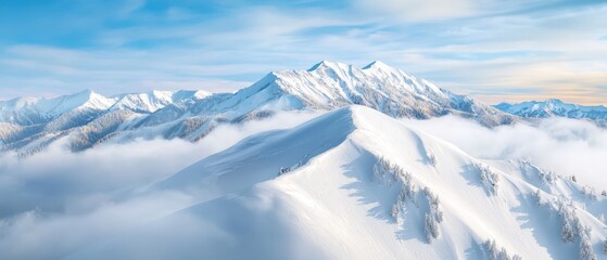 Fototapeta premium Abird's-eye perspective of a snowy mountain range Trees dot the foreground, contrasting against the backdrop of a blue sky adorned with clouds