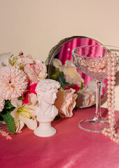 Romantic floral layout, champagne glass, roses and pearls