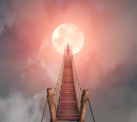 A person stands at the top of a wooden bridge ascending toward a large glowing moon, surrounded by ethereal clouds during twilight