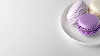 Fototapeta premium Purple, lilac, and cream macarons on white plate
