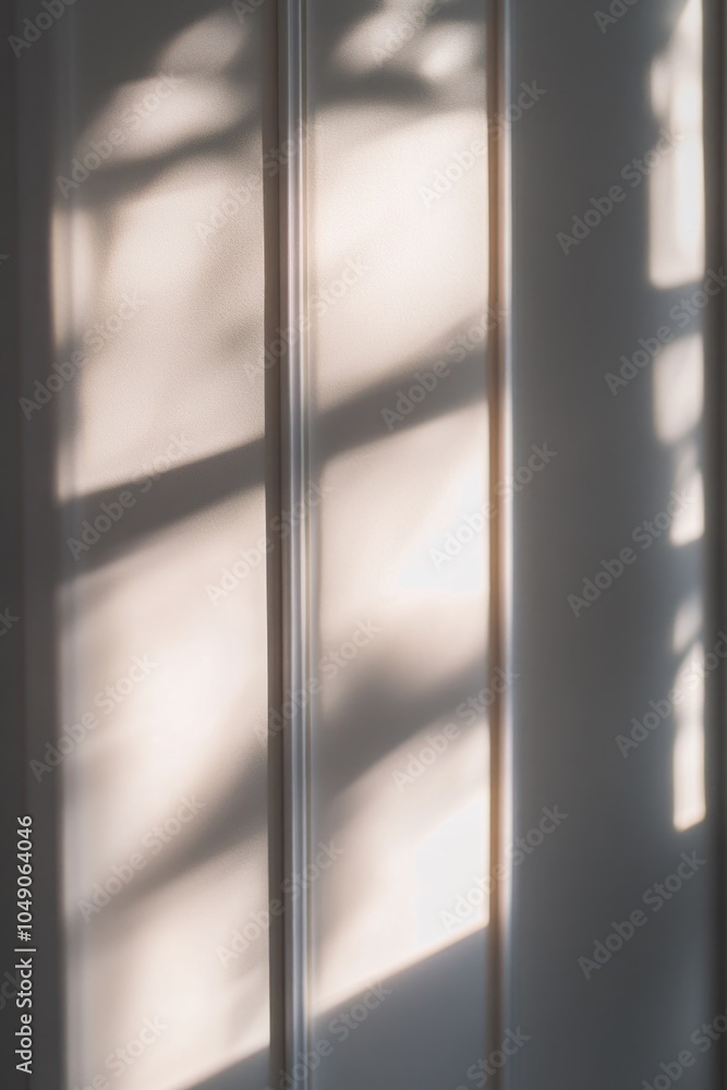 Poster white wall with a window and a shadow cast on it. the shadow is long and stretches across the wall, 