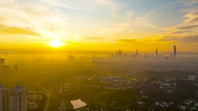 An establish aerial hyperlapse shot of Kuala Lumpur city overseeing the main four towers skyscrappers during morning