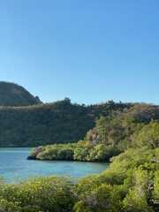 Green hills and blue ocean on a sunny day