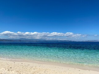 Beach view with blue clear water on an small tropical island