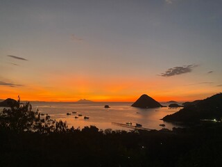 Sunset View on the ocean, some boats and small islands, Labuan Bajo, Komodo National Park, Indonesia