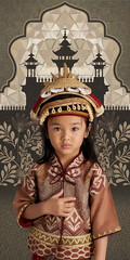 Obraz premium Young girl in traditional Asian clothing gold and red cultural heritage celebration of tradition 