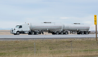 Fototapeta premium Heavy Cargo on the Road. A truck hauling freight along a highway. 